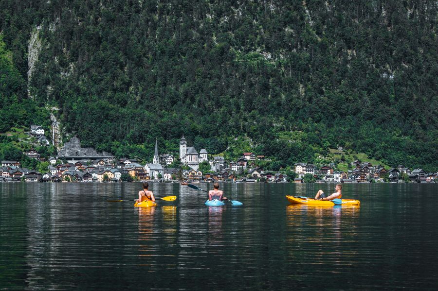 Kayakers paddling on a calm lake (stock photo)